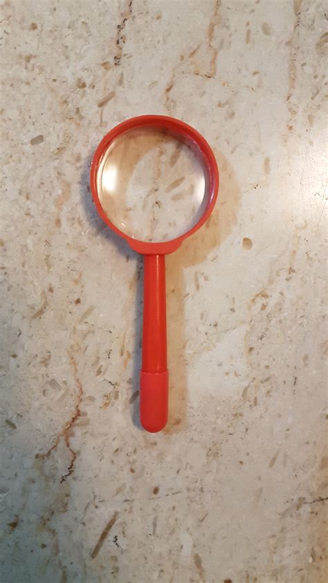 How hot can a small magnifying glass get?